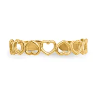 Gold-toned bangle bracelet with repeating open heart cutout design arranged in a continuous pattern around the band.