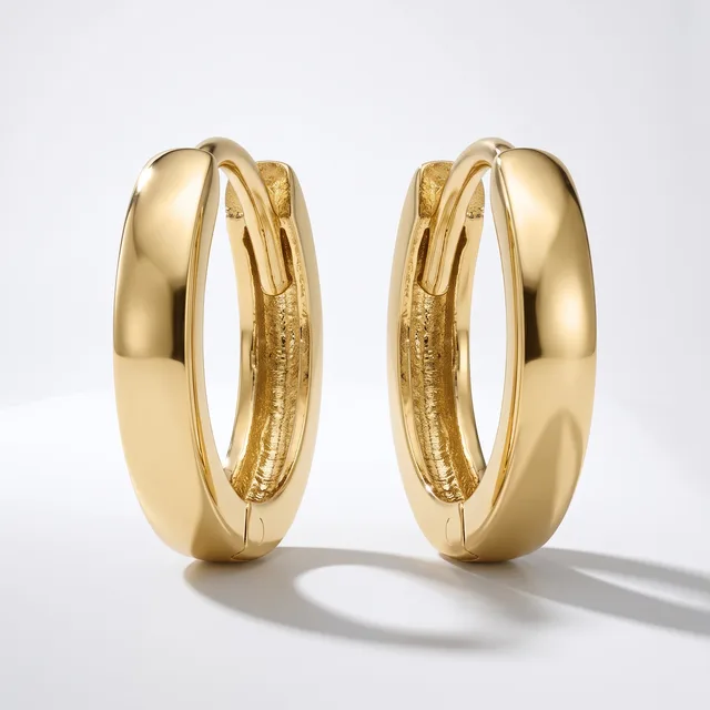 A pair of polished gold hoop earrings with a smooth, rounded profile, shown from the front and side view against a white background.