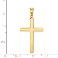 A polished gold cross pendant shown against a ruler measuring approximately 1.75 inches in height, with a small attached bail at the top.