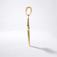 A gold-toned metal shoehorn with an oval loop handle at the top and a flat, tapered blade, displayed standing upright against a white background.