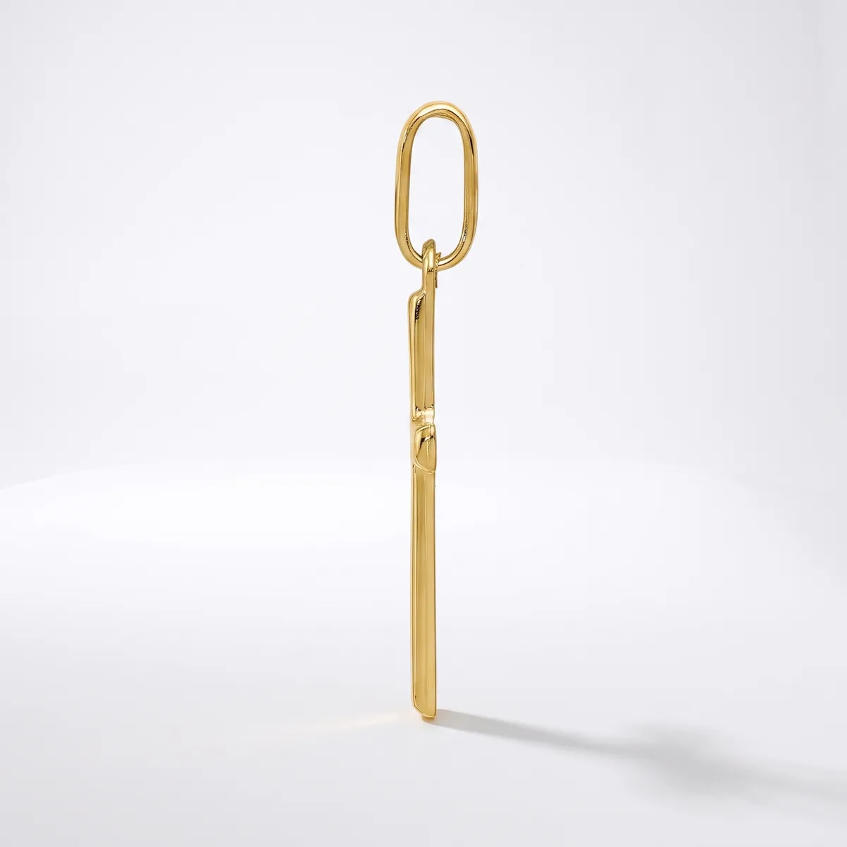 A gold-colored elongated oval link chain attachment with a straight stem, displayed vertically against a white background.