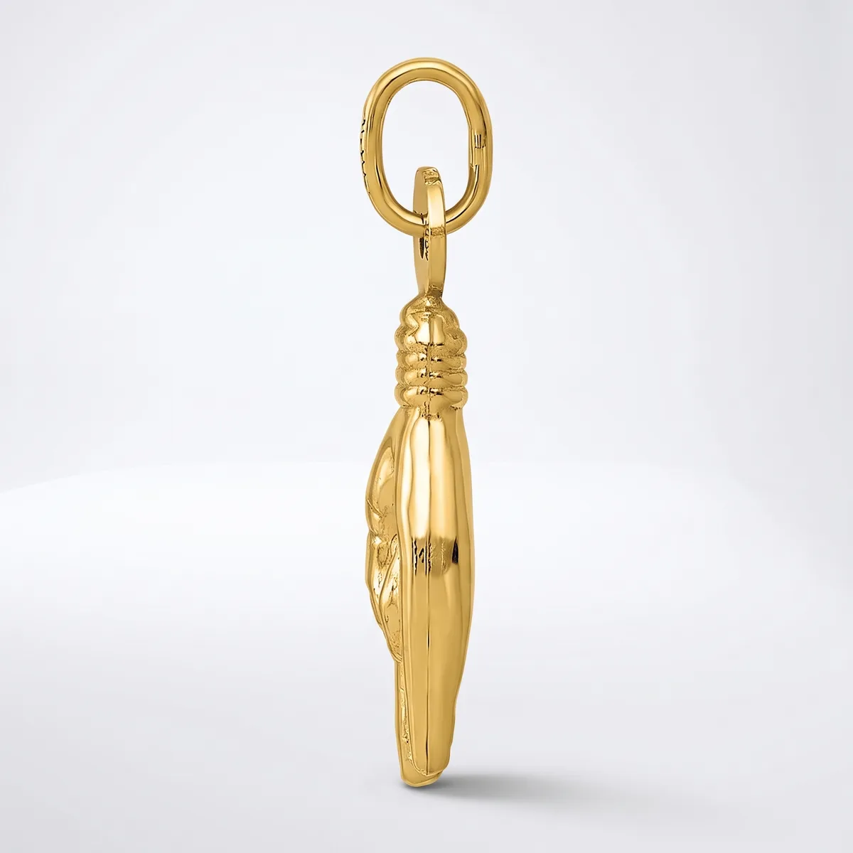 A gold peanut-shaped pendant with vertical ridged detailing, suspended from a gold oval loop against a white background.