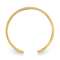 A polished gold-colored open cuff bracelet with a smooth, curved band shown against a white background.