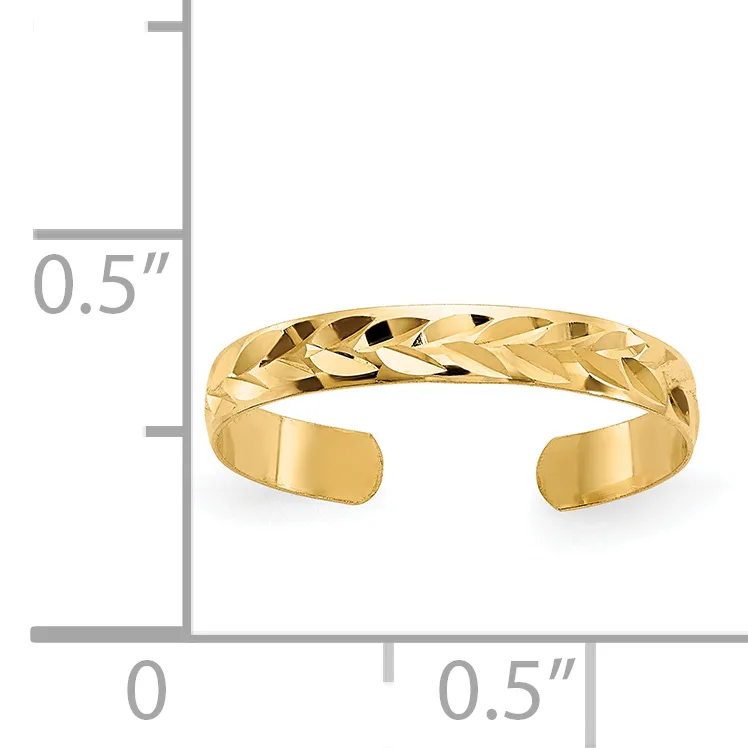 A gold cuff bracelet with a textured diamond-cut pattern shown next to a measurement scale indicating approximately 0.5 inches in height.