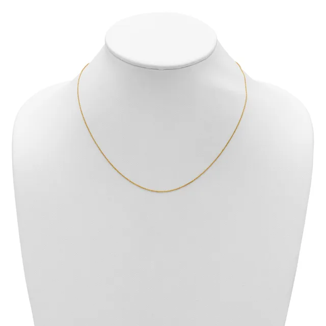 A thin gold-toned chain necklace displayed on a white mannequin bust.
