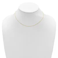 A thin gold-toned chain necklace displayed on a white mannequin bust.
