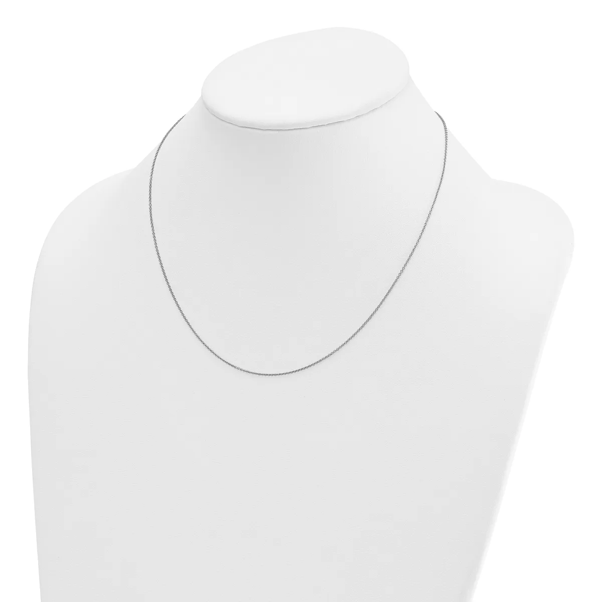 A thin silver-toned chain necklace displayed on a white mannequin bust.
