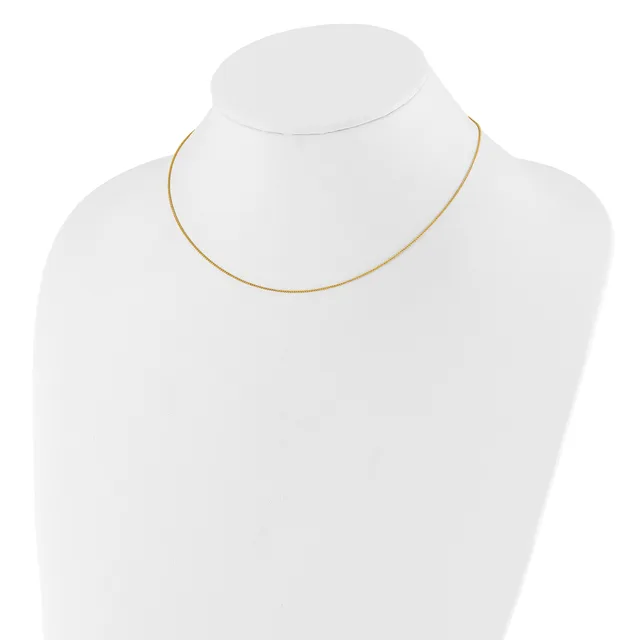 A thin gold-toned snake chain necklace displayed on a white bust form.
