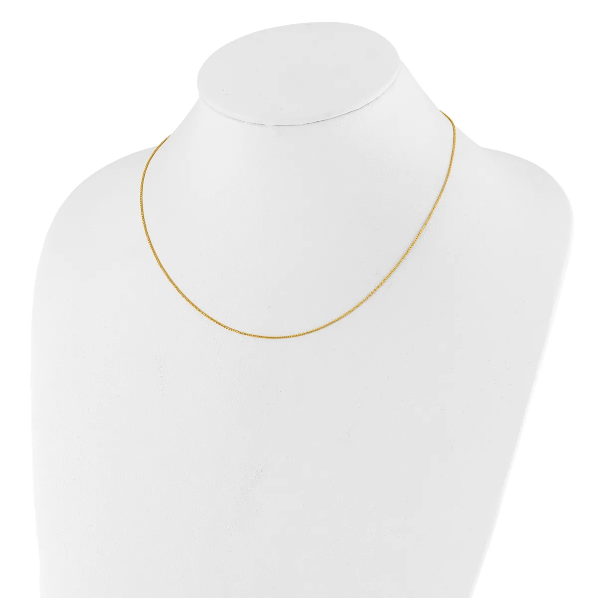 A thin gold-toned snake chain necklace displayed on a white mannequin bust.