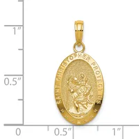 Gold oval pendant featuring Saint Christopher carrying the Christ child, surrounded by stars and text around the border, shown next to a measurement scale.