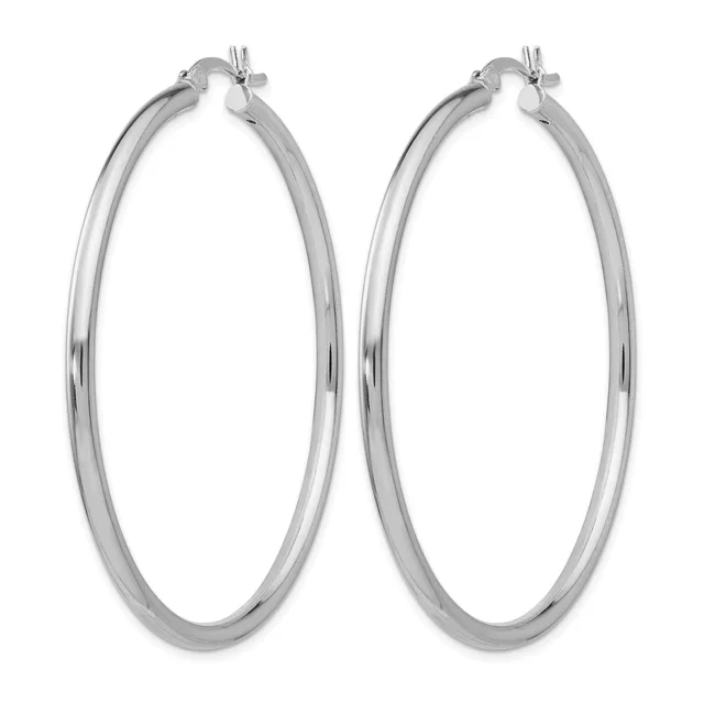 A pair of polished silver-toned hoop earrings with a smooth, rounded tubular design and toggle closures at the top.