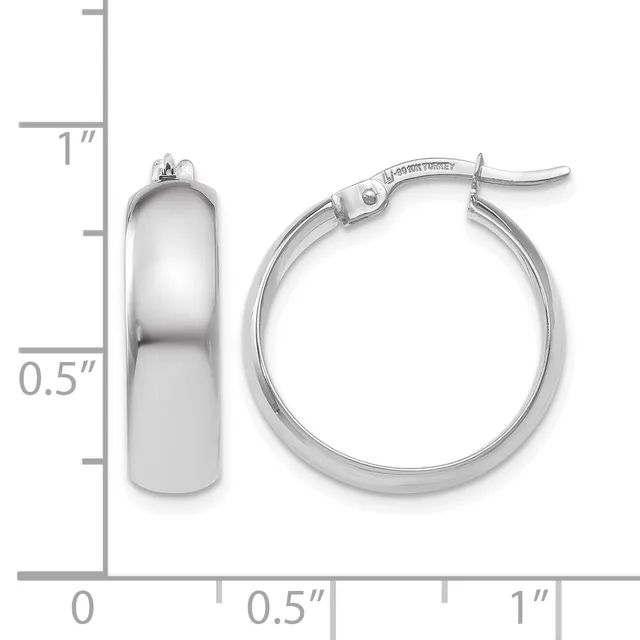 Pair of polished silver-toned chunky hoop earrings with hinged closures, displayed next to a ruler showing approximately one inch in diameter and half inch in width.