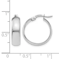 Pair of polished silver-toned chunky hoop earrings with hinged closures, displayed next to a ruler showing approximately one inch in diameter and half inch in width.