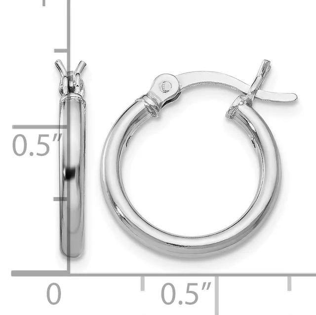 A pair of silver hoop earrings with a polished finish and toggle clasp closures, shown against a measurement scale indicating approximately half-inch diameter.