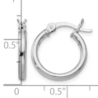 A pair of silver hoop earrings with a polished finish and toggle clasp closures, shown against a measurement scale indicating approximately half-inch diameter.