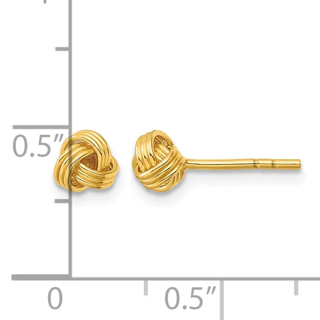 A pair of polished gold knot stud earrings displayed against a ruler showing them to be approximately 0.5 inches in size.