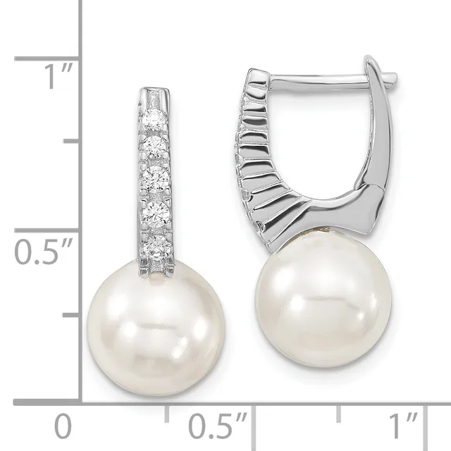 Pair of silver hinged earrings with diamond-studded tops and white pearl drops, shown against a measurement scale indicating approximately one inch in length.