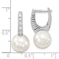 Pair of silver hinged earrings with diamond-studded tops and white pearl drops, shown against a measurement scale indicating approximately one inch in length.