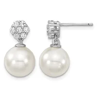 A pair of silver drop earrings with diamond-set stud tops and large round white pearl pendants, shown from front and back views.