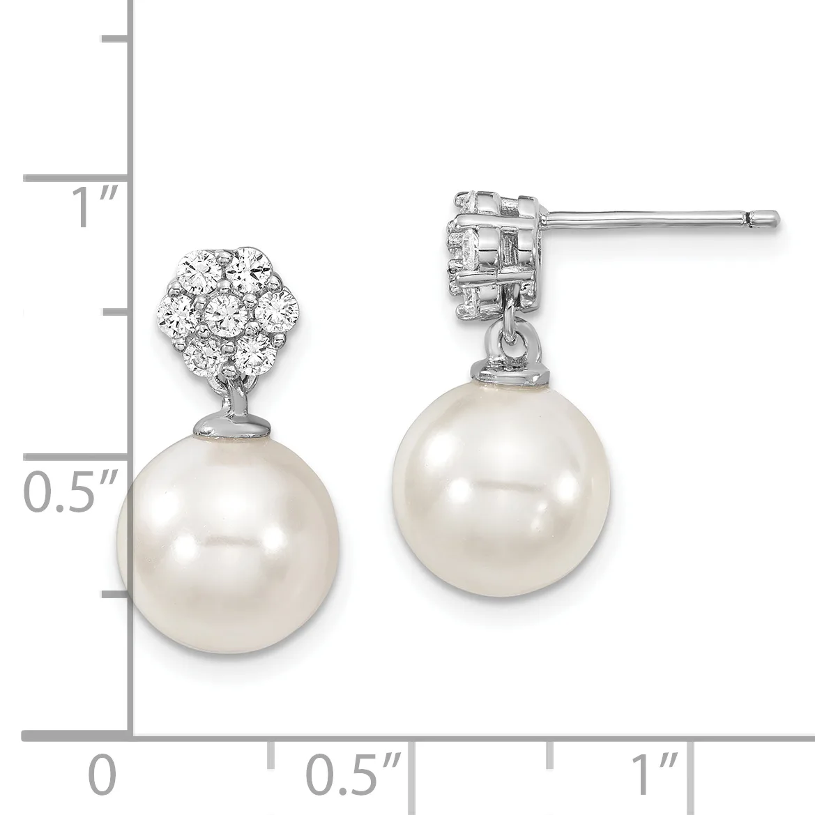Pair of silver drop earrings with diamond-studded posts and round white pearl pendants, shown on a measurement scale indicating approximately one inch in length.