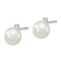 Pair of stud earrings featuring white pearl spheres topped with small square diamond settings on silver posts.