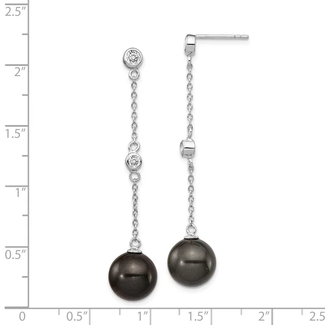Silver dangle earrings with cubic zirconia studs, delicate chain links, and dark gray pearl drops, displayed against a measurement ruler.