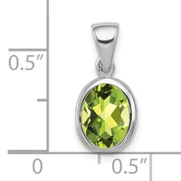Silver pendant with oval faceted yellow-green peridot stone set in bezel, shown with size scale indicating approximately 0.5 inches in height and width.