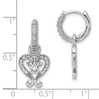 Pair of silver hug hoop earrings with dangling heart charms outlined in cubic zirconia, displayed next to a measurement scale showing approximately one inch in length.