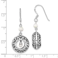 Pair of silver filigree earrings with pearl accents, featuring circular and oval openwork designs, displayed on a measurement scale showing approximately 1.5 inches in length.