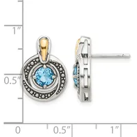 Two-tone circular stud earrings with blue topaz centers surrounded by beaded silver borders and gold bail tops, shown front and side view with measurement scale.