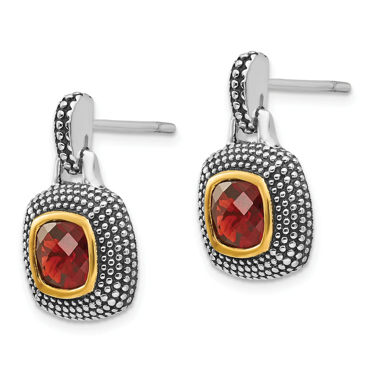 A pair of drop earrings with silver posts, featuring cushion-cut red gemstones set in gold bezels surrounded by beaded silver bezels.