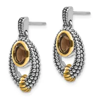 Pair of two-tone silver and gold dangle earrings with oval smoky quartz stones surrounded by beaded texturing and small gold accents.