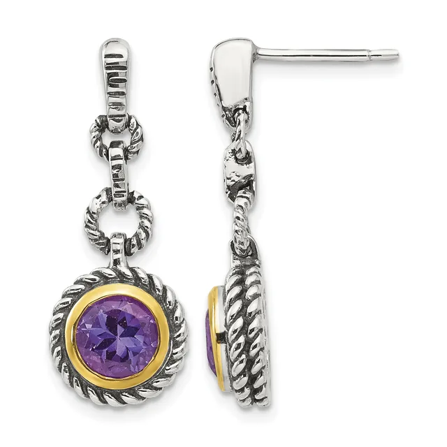 Pair of silver dangle earrings with twisted rope detailing, bezel-set round purple amethyst stones rimmed in gold, shown from front and side views.