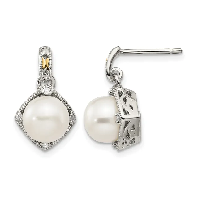 Pair of silver drop earrings with white pearl centers surrounded by diamond halos and decorative gold accents on the posts, shown from front and side views.