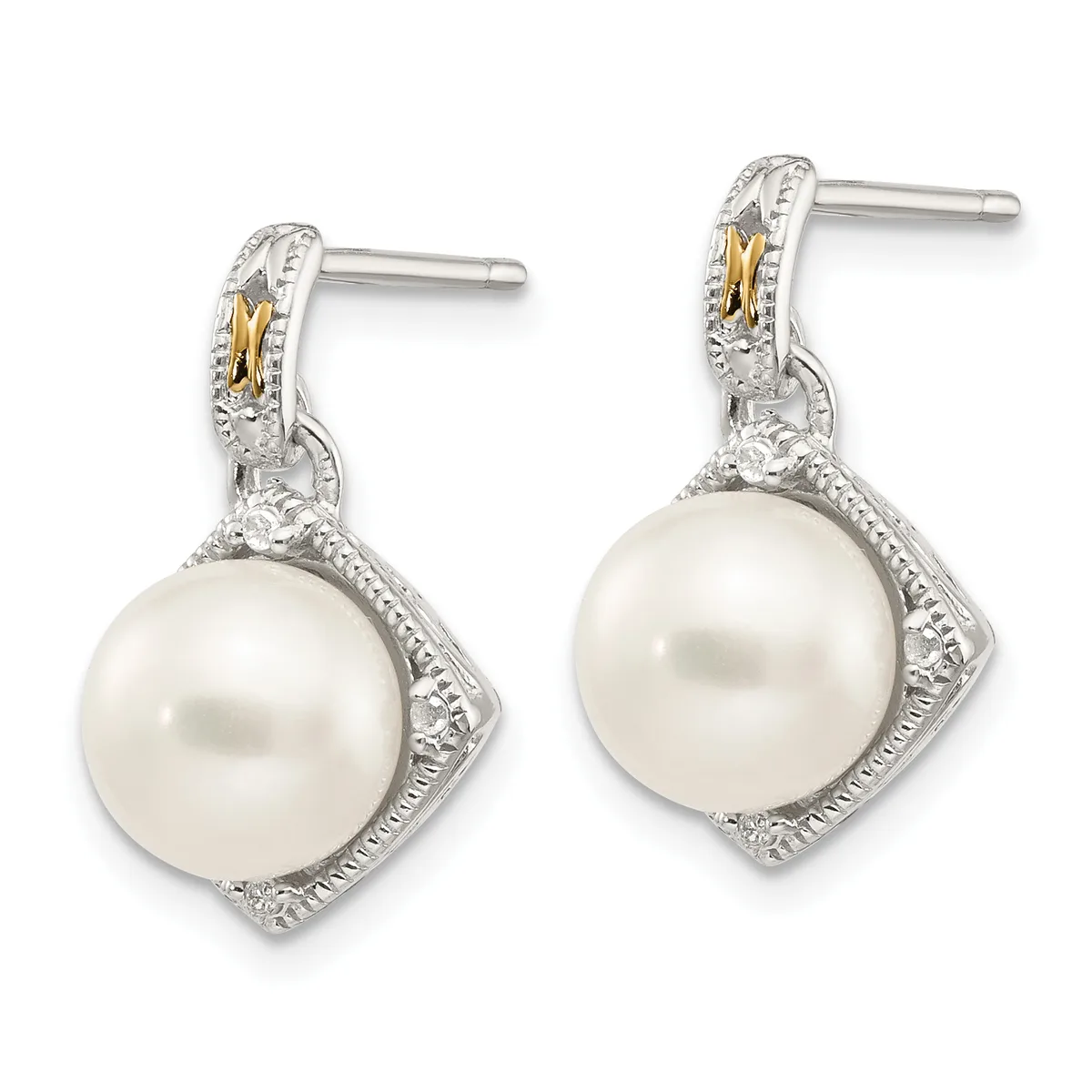 Pair of silver and gold drop earrings with white pearl pendants surrounded by diamond accents and decorative metalwork.