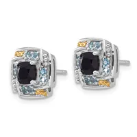 A pair of square stud earrings featuring black cushion-cut center stones surrounded by light blue and yellow gemstones set in two-tone silver and gold metal.
