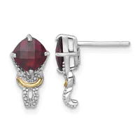 Pair of dangling earrings with cushion-cut red gemstones in silver settings with gold accents, shown from front and side views.