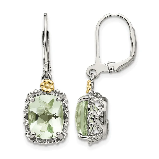 A pair of silver and gold-tone leverback earrings with cushion-cut pale green gemstones surrounded by ornate metalwork.