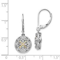 A pair of ornate silver and gold two-tone lever back earrings with circular filigree pendants set with diamonds, displayed next to a measurement scale.