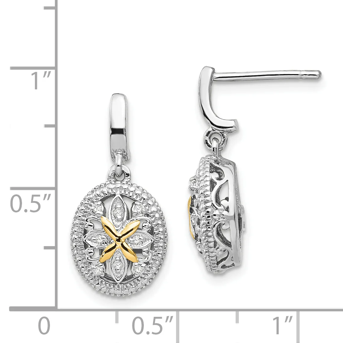 A pair of silver drop earrings with oval pendants featuring a four-pointed star design in gold at the center, surrounded by diamond accents, shown against a measurement scale.