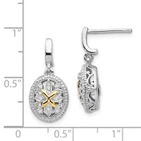 A pair of silver drop earrings with oval pendants featuring a four-pointed star design in gold at the center, surrounded by diamond accents, shown against a measurement scale.
