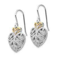 A pair of silver heart-shaped dangle earrings with textured surfaces and gold-tone heart charms at the top, suspended from silver hook wires.