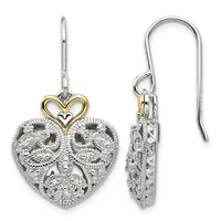 Pair of silver heart-shaped drop earrings with ornate filigree detailing and gold-toned heart charms on silver ear wires, shown from front and side views.