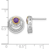Pair of two-tone silver and gold stud earrings with purple round gemstones surrounded by concentric circular bezels dotted with small beads, shown next to a measurement ruler.