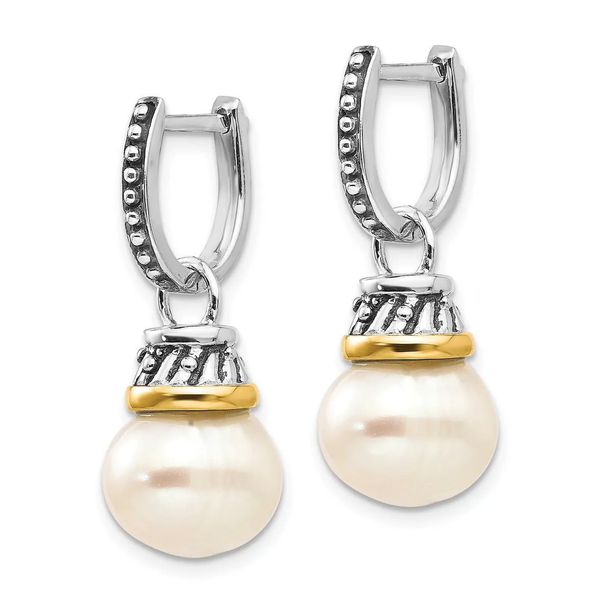 A pair of silver hoop earrings with beaded edges, each featuring a decorative gold-toned band and a large round white pearl suspended below.