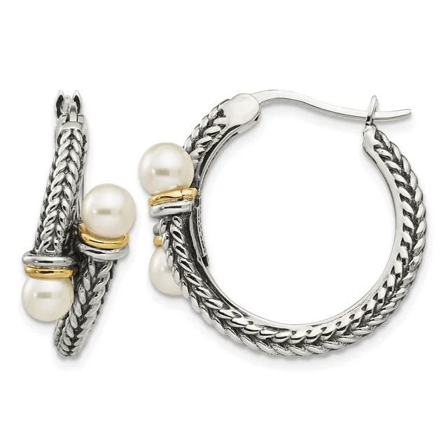 Pair of silver twisted rope hoop earrings with three white pearl accents and gold-tone spacer bands, shown from front and side views.