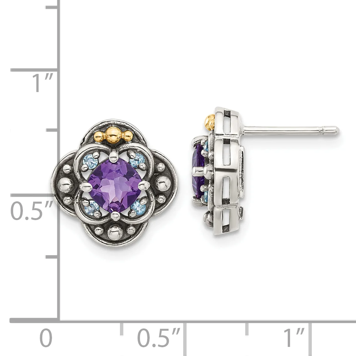 Pair of ornate stud earrings featuring purple faceted gemstones surrounded by light blue stones and decorative metalwork in silver and gold tones, shown against a measurement scale.