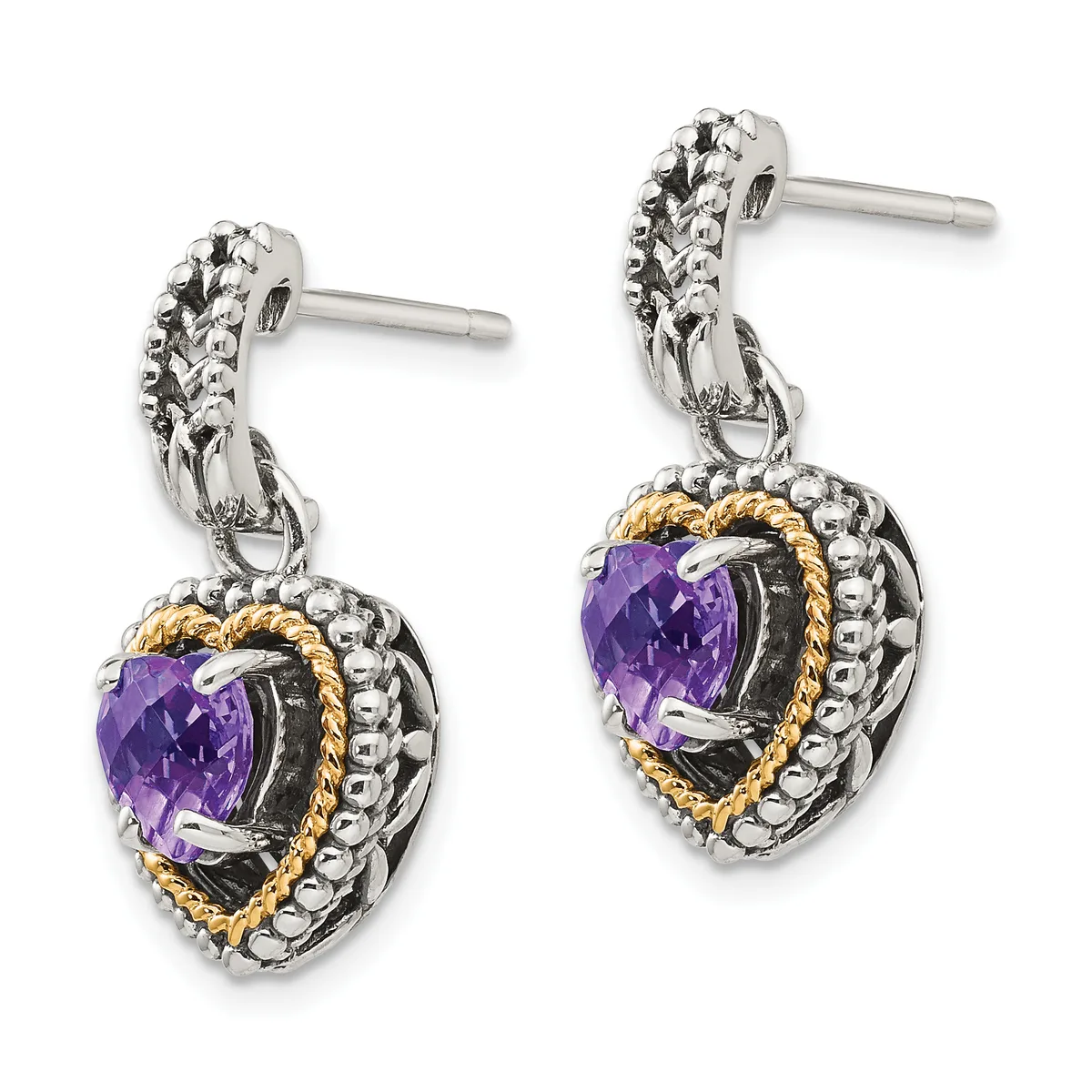 Pair of silver and gold-toned dangle earrings with purple heart-shaped stones surrounded by decorative beaded and twisted metalwork, shown from the front.