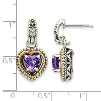 Pair of silver heart-shaped dangle earrings with purple amethyst centers, gold-tone beaded borders, and decorative posts, shown against a measurement scale.