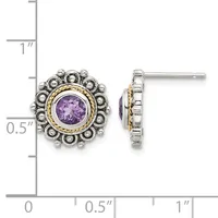 Pair of silver and gold-tone stud earrings with round purple amethyst centers surrounded by a halo of small beaded spheres, displayed next to a measurement ruler.